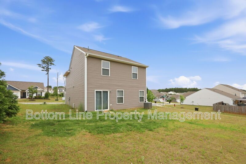 295 Windbreak Lane, Youngsville, NC 27596  $[Insert Listing Price] | 3 Bedrooms | 3 Bathrooms | 1,858 Sq Ft property image