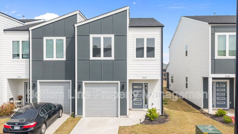 ✨ End-Unit Townhome with Designer Finishes, Screened Porch & Garage in Prime Durham Location property image