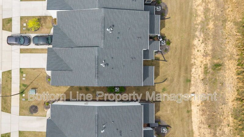 ✨ End-Unit Townhome with Designer Finishes, Screened Porch & Garage in Prime Durham Location property image