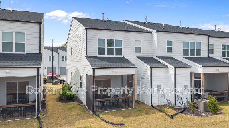 ✨ End-Unit Townhome with Designer Finishes, Screened Porch & Garage in Prime Durham Location property image