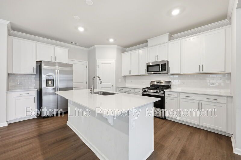 ✨ End-Unit Townhome with Designer Finishes, Screened Porch & Garage in Prime Durham Location property image
