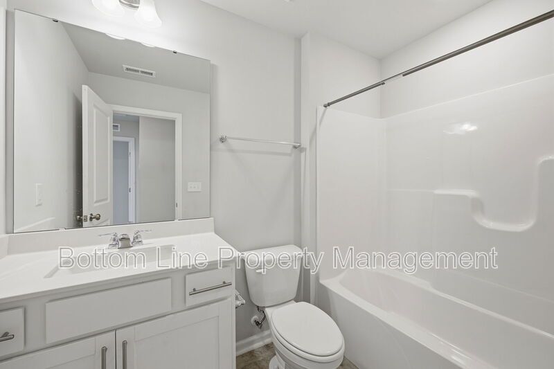✨ End-Unit Townhome with Designer Finishes, Screened Porch & Garage in Prime Durham Location property image