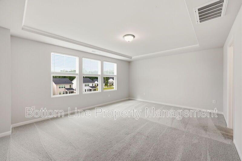 ✨ End-Unit Townhome with Designer Finishes, Screened Porch & Garage in Prime Durham Location property image
