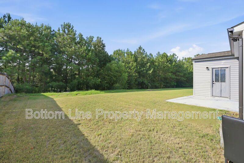 Solar-Powered Home! 4BR/3BA Home with Main-Level Guest Suite & Tesla Charging Station! property image