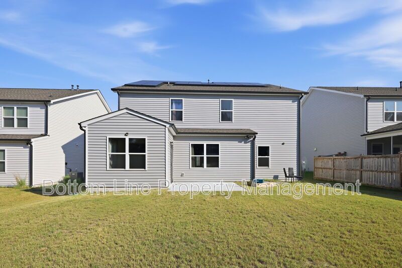 Solar-Powered Home! 4BR/3BA Home with Main-Level Guest Suite & Tesla Charging Station! property image