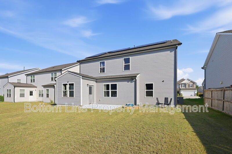 Solar-Powered Home! 4BR/3BA Home with Main-Level Guest Suite & Tesla Charging Station! property image