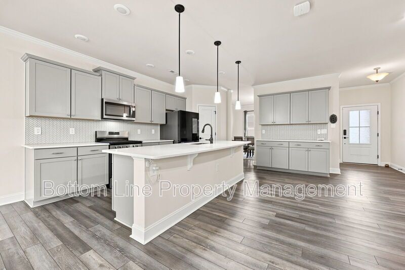 Solar-Powered Home! 4BR/3BA Home with Main-Level Guest Suite & Tesla Charging Station! property image