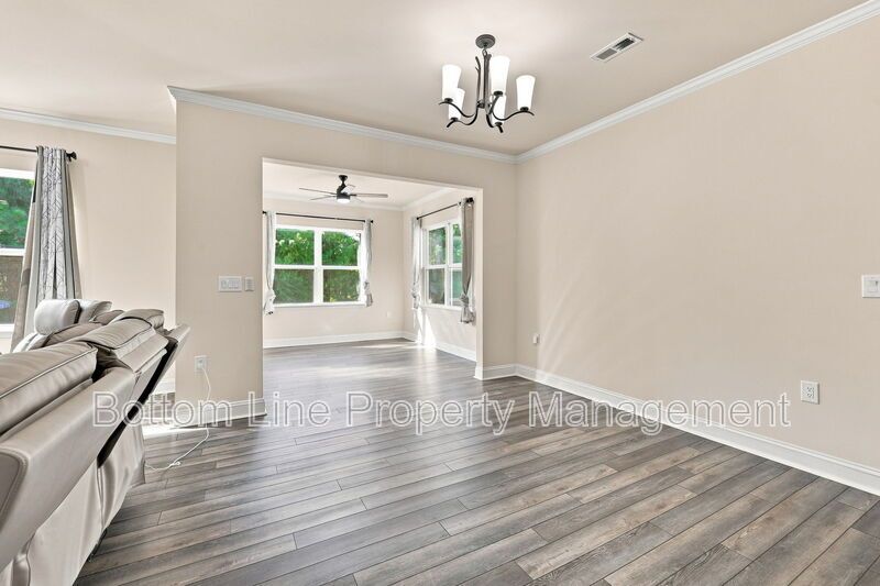Solar-Powered Home! 4BR/3BA Home with Main-Level Guest Suite & Tesla Charging Station! property image