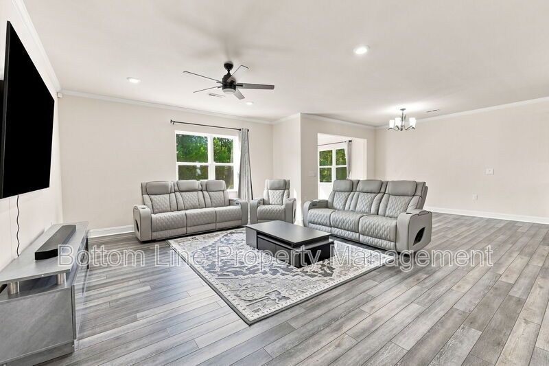 Solar-Powered Home! 4BR/3BA Home with Main-Level Guest Suite & Tesla Charging Station! property image
