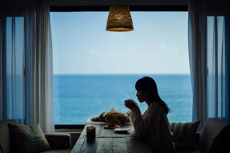 Young woman having coffee