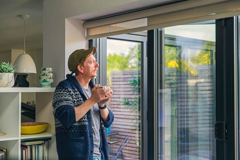 Man looking out a window