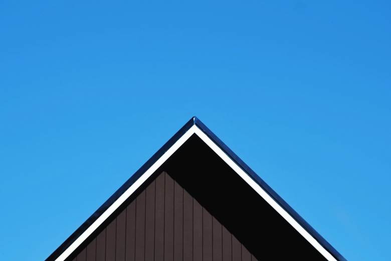 A wooden roof against the bright sky