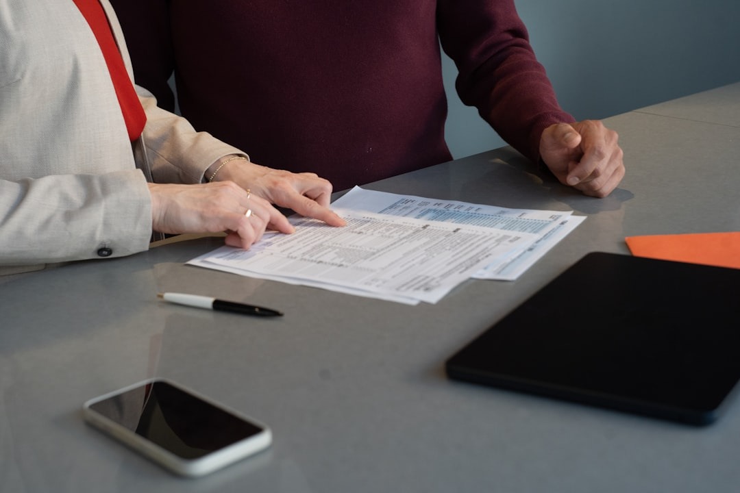 Two people reviewing documents at a table